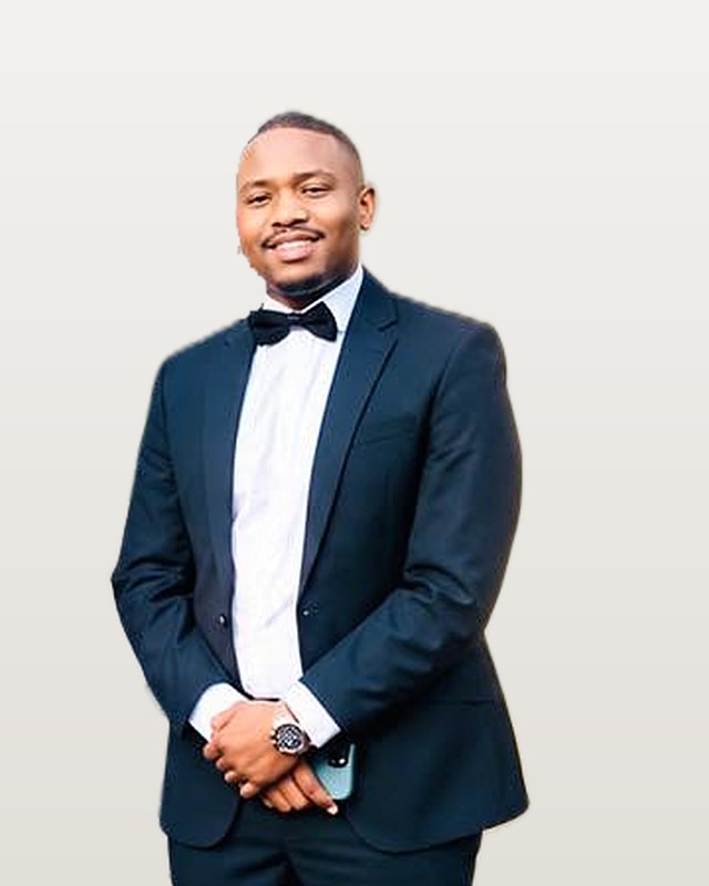 Nkanyezi Ntuli in a navy suit and bow tie